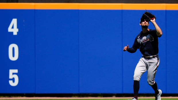 Mar 2, 2023; Port St. Lucie, Florida, USA; Atlanta Braves center fielder Eli White (38) catches a fly ball against the New York Mets during the second inning at Clover Park.